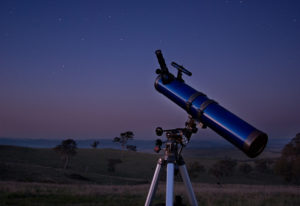 Stargazing telescope looking downward at the earth.