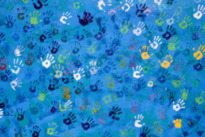 Hopeful Helping Hands - painted handprints on a wall