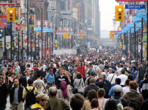 Crowds of people walking down a Toronto city street.