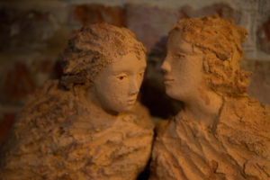 Sculpture of two women in close conversation