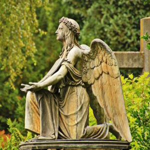 Statue of an angel kneeling in worship