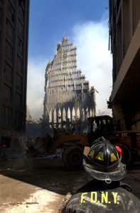 A firefighter looks on at the remains of the Twin Towers following the 9/11 terrorist attacks.