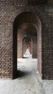 Looking down a row of fortified archways.