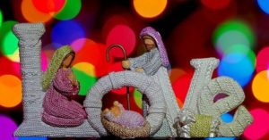 A manger scene set in the word Love