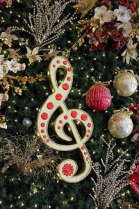 A Christmas tree ornament in the shape of a treble clef.