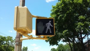 A walk signal of a traffic light.
