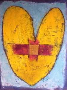 A painted heart with a cross shaped patch on it.