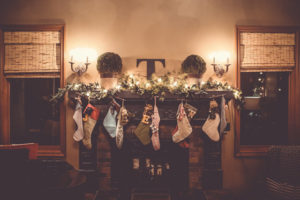an inviting photo of stockings unhung for a family's homecoming at Christmas.