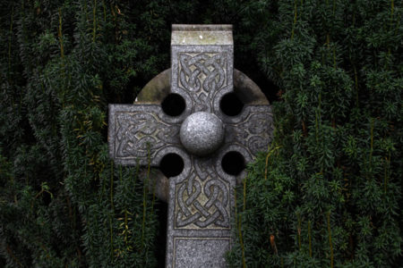 A Celtic cross made of stone.
