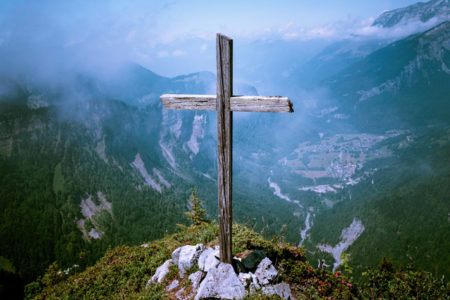 A cross on a mountaintop.