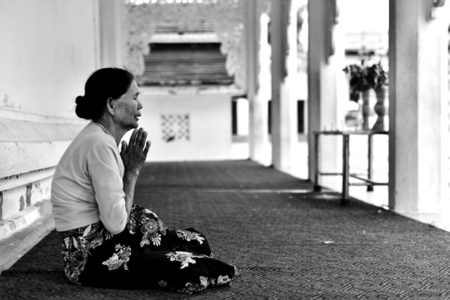 A woman praying.